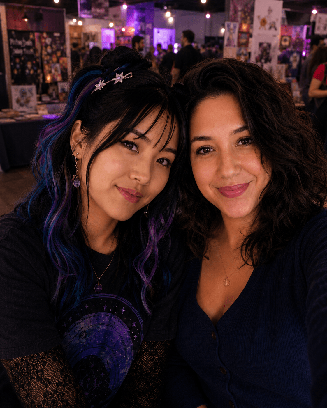 Two friends smiling together at a creative community event